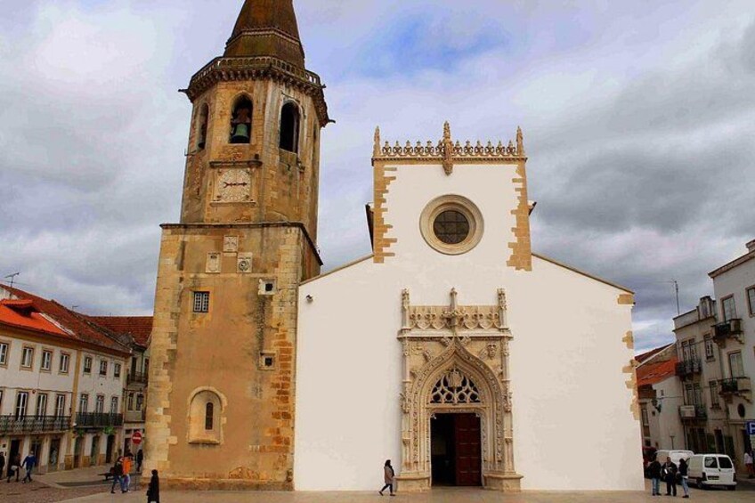 A historic church with a bell tower and ornate entrance. 5