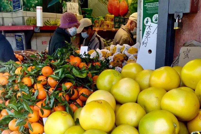 A fruit market with oranges and lemons. 3