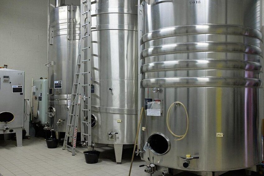 Stainless steel fermentation tanks in a brewery. 5