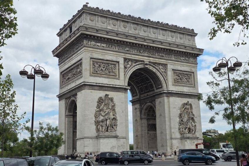 The Arc de Triomphe with intricate carvings and a large archway. 2