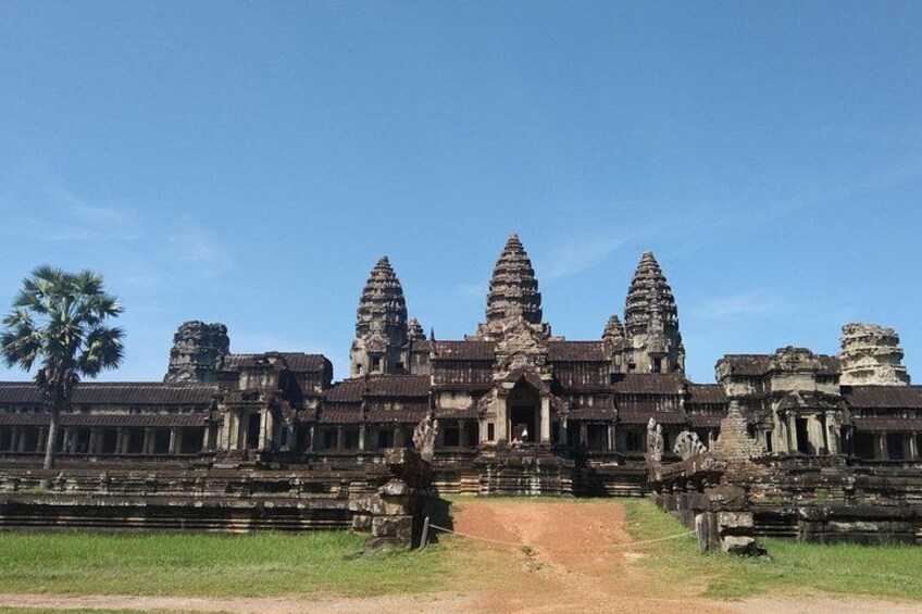Angkor Wat temple complex with multiple towers and a central entrance. 2
