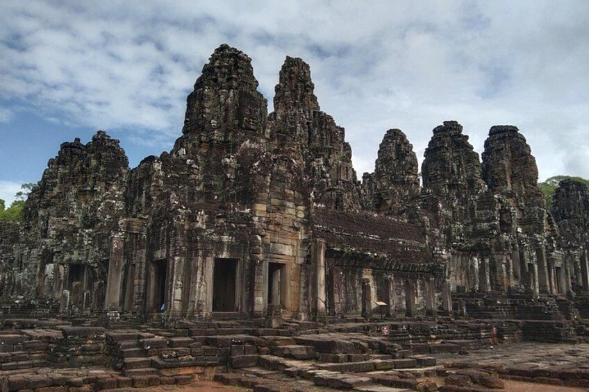 A large, ancient stone temple with multiple towers and a central entrance. 3