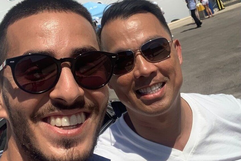 Two people wearing sunglasses and white shirts. 3