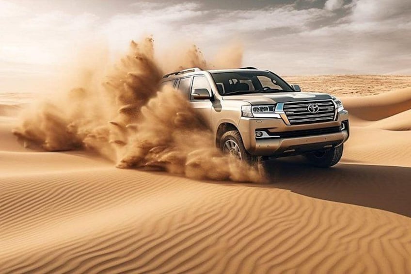 A vehicle driving through a desert with sand dunes. 1