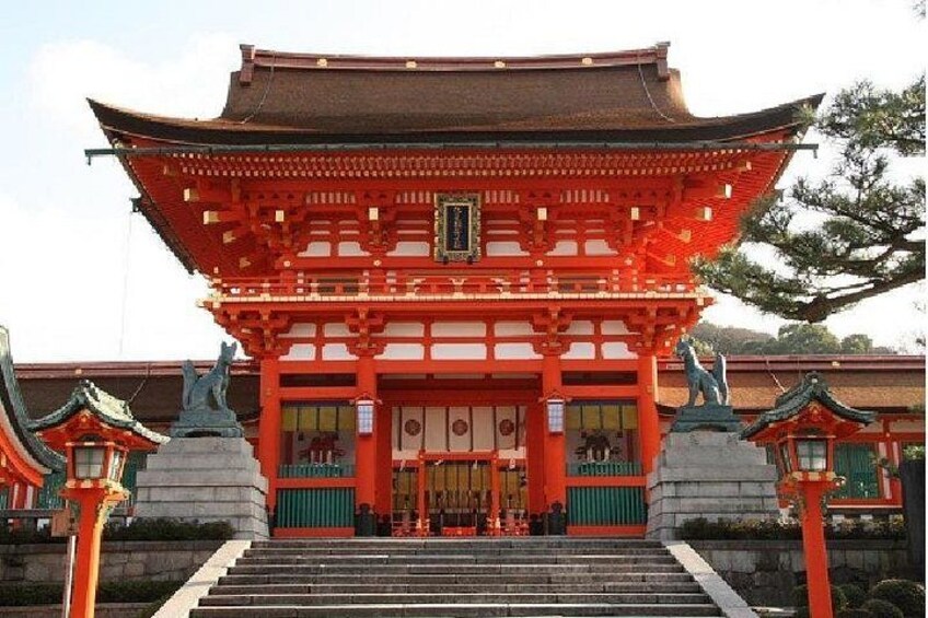 A traditional Japanese building with a red roof and wooden structure. 5