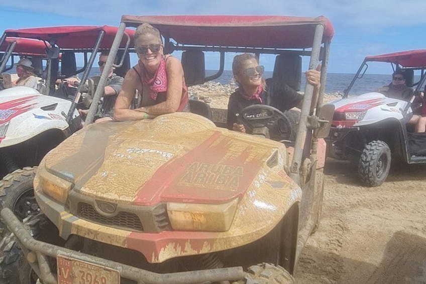 A sandy beach with off-road vehicles. 5