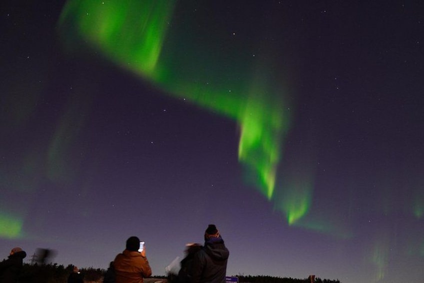 People observing the Northern Lights. 1