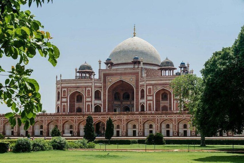A large, historic building with a prominent dome and arched windows. 5