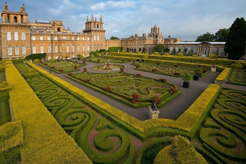 A grand palace with manicured gardens and intricate pathways. 3