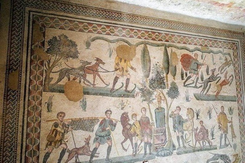 A detailed mosaic with human figures, animals, and plants. 3