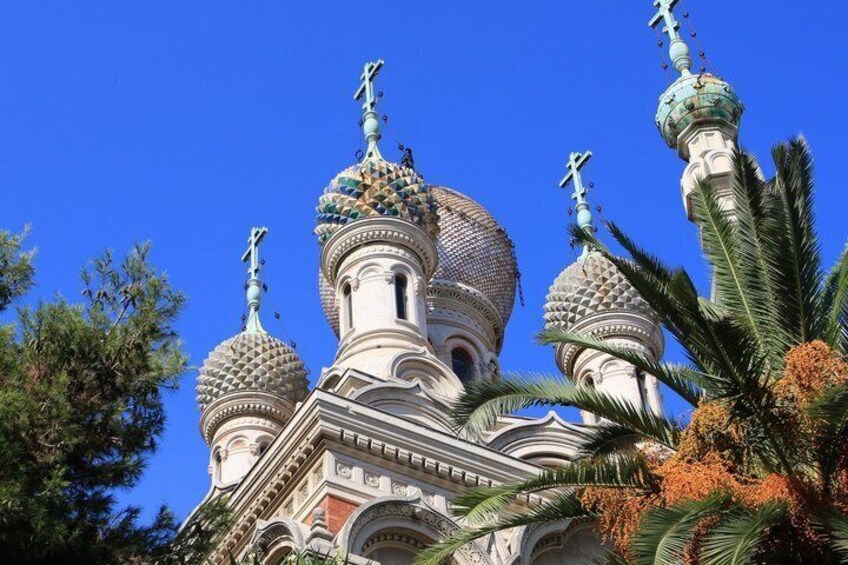 A church with ornate domes and crosses. 4