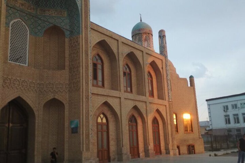 A historic building with arched windows and a dome. 1