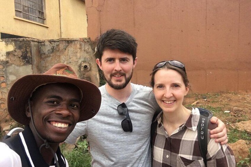 Three people standing in an outdoor setting with a building in the background. 3