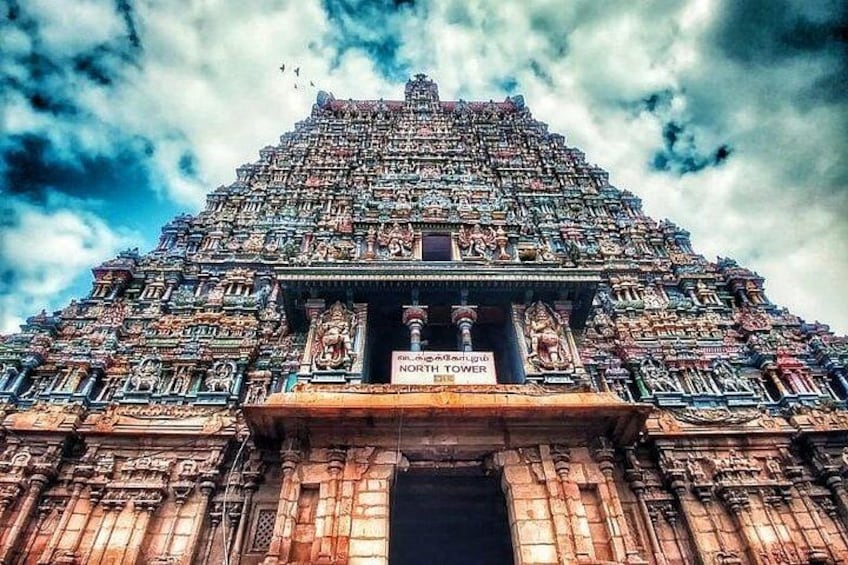 A temple with a sign reading 'NORTH TOWER'. 4