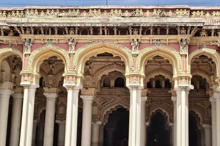 A detailed architectural facade with ornate arches and columns. 2