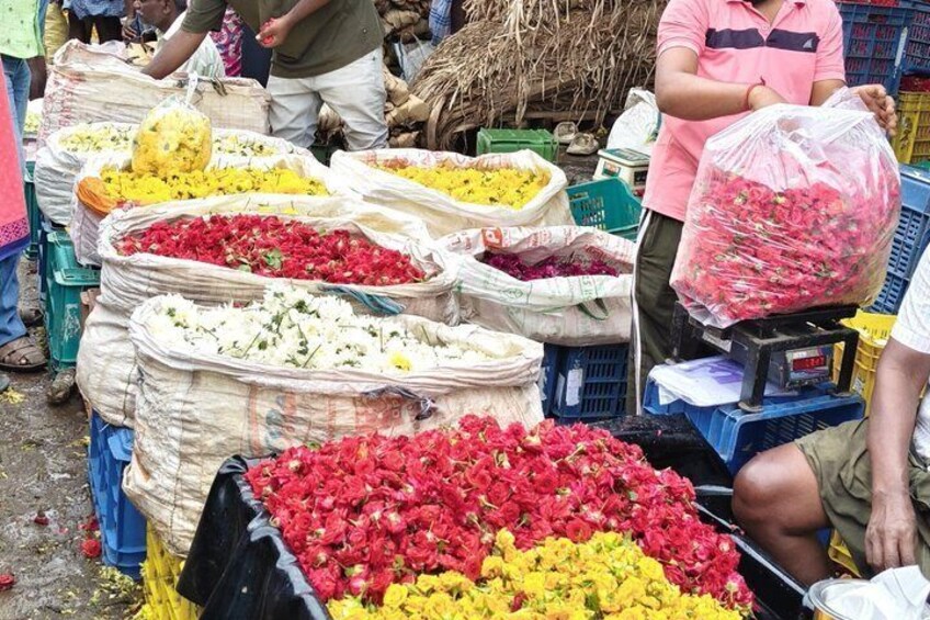 A market with large bags of flowers. 5