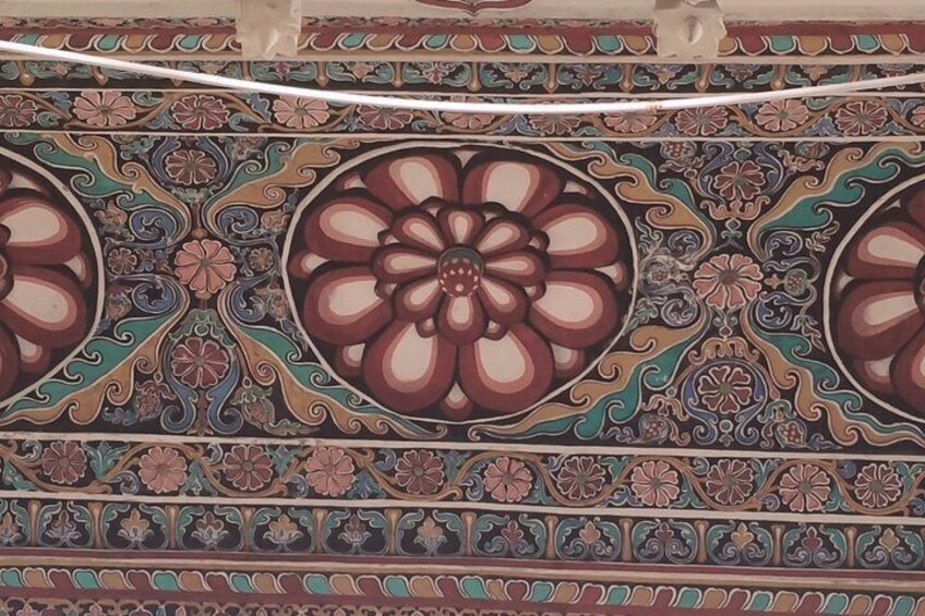 A detailed tile pattern with floral motifs and geometric designs. 4