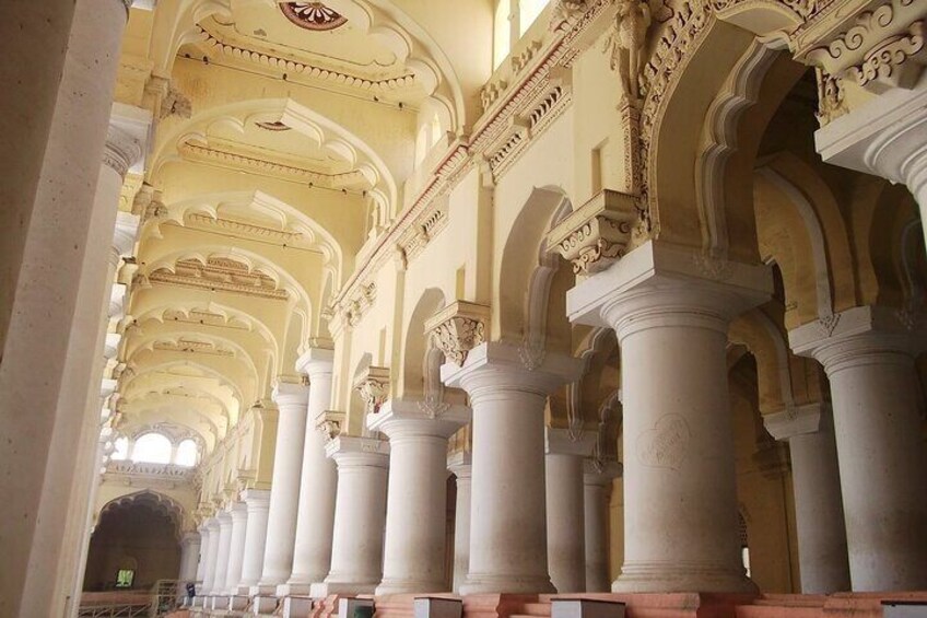 An interior with ornate arches and columns, likely part of a historical building. 5