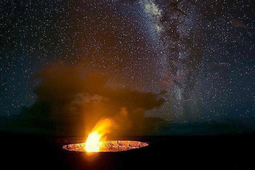 A night sky with stars and the Milky Way, a bright light source, and a dark foreground. 3