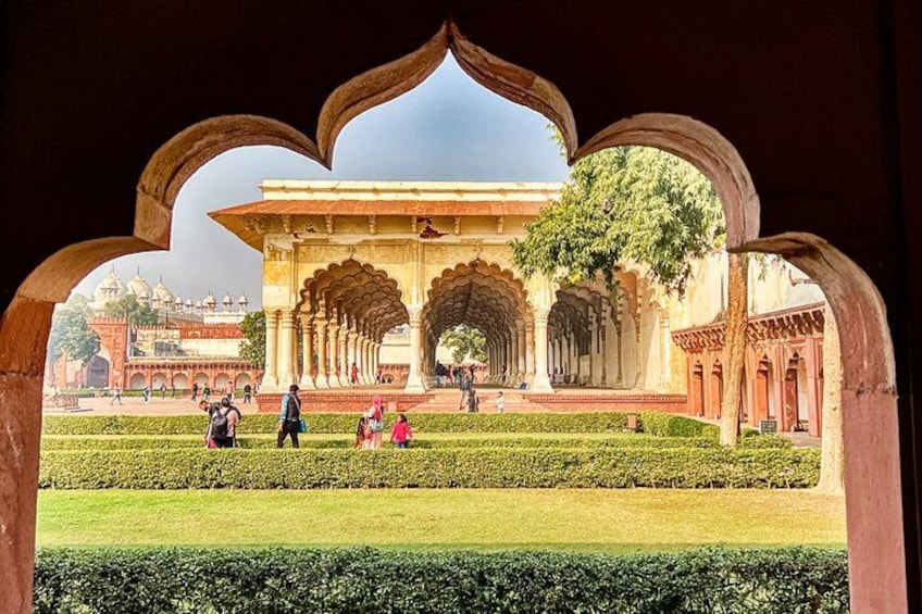A historical building with arches and a courtyard. 3