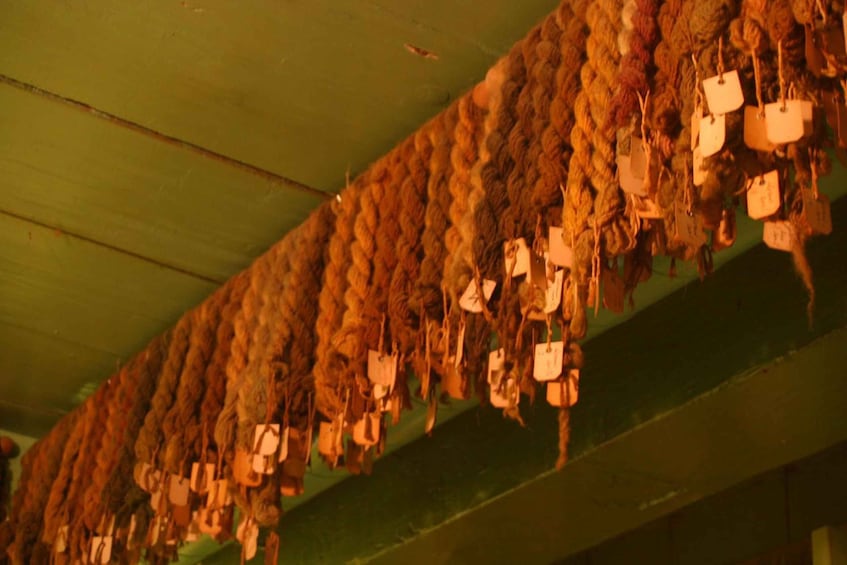 A ceiling with hanging tags. 3