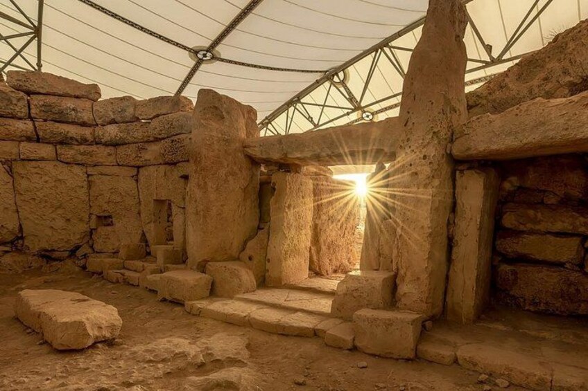 Ancient stone ruins with a central staircase and a partially intact wall structure. 4