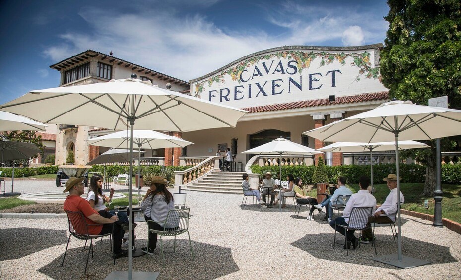 Outdoor seating with umbrellas at Cavas Freixenet. 1