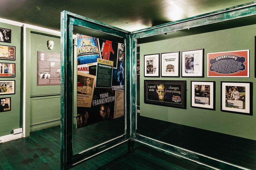 A museum exhibit with posters and framed advertisements. 5