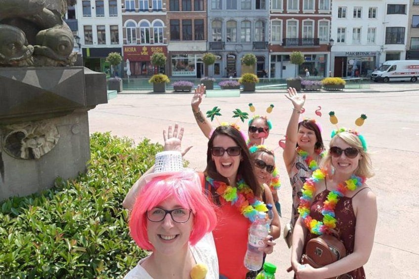 A group of people in a public square with buildings in the background. 4