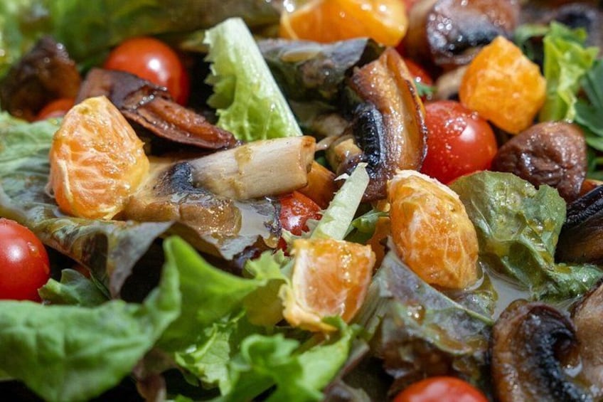 A salad with various vegetables and fruits. 3
