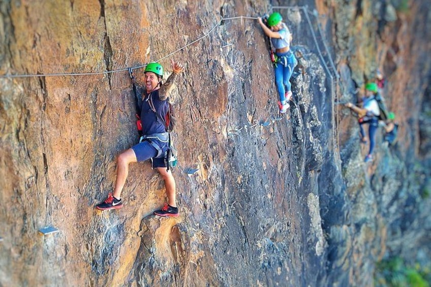 A person climbing a rock face. 2