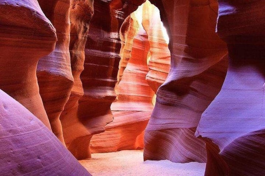 A canyon with layered rock formations. 1