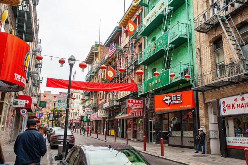 Paper lanterns are strung across the street in Chinatown, a San Francisco neighborhood travelers can explore on a walking tour. 4