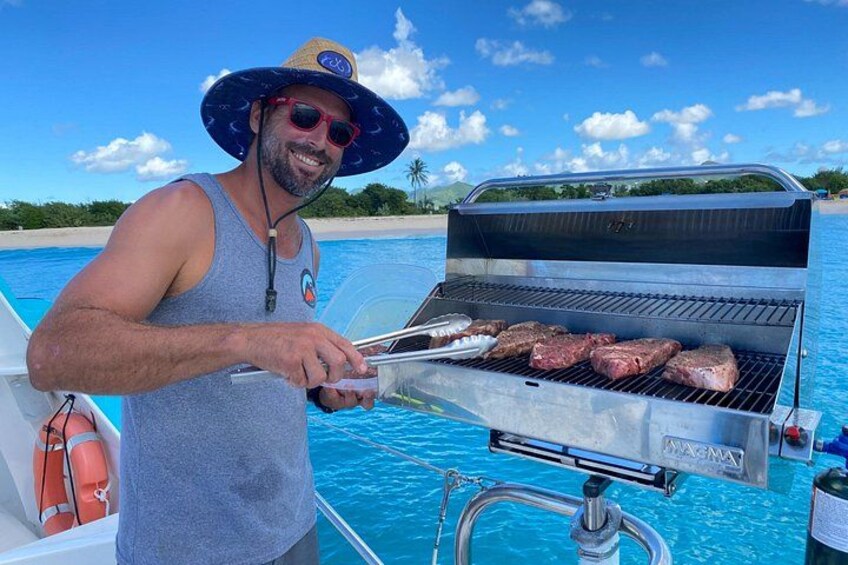 A person grilling steaks on a boat near a pool. 4