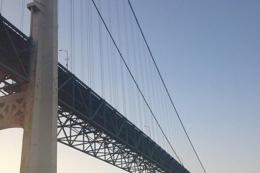 A bridge with a steel truss structure and multiple cables. 4