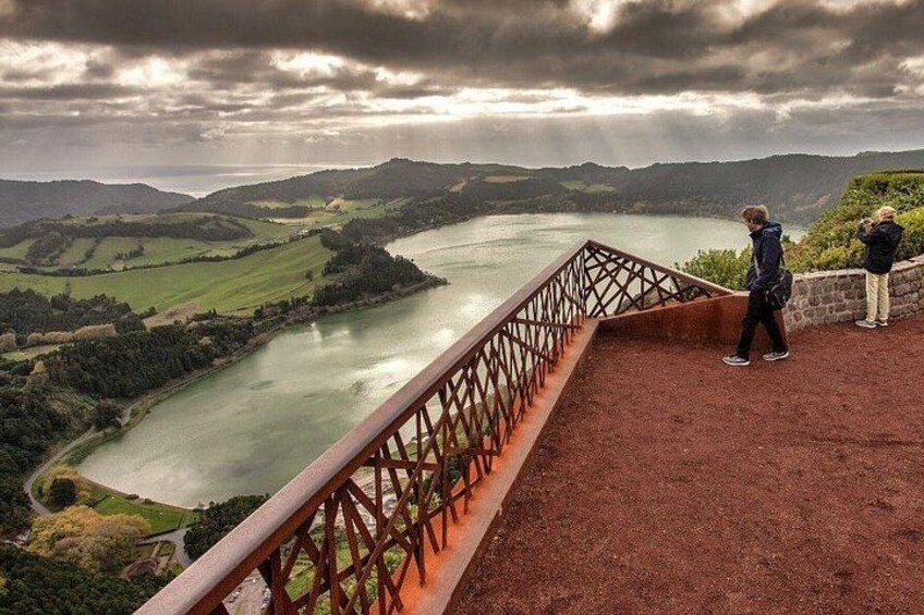 A river, a bridge, and two people observing the landscape. 2