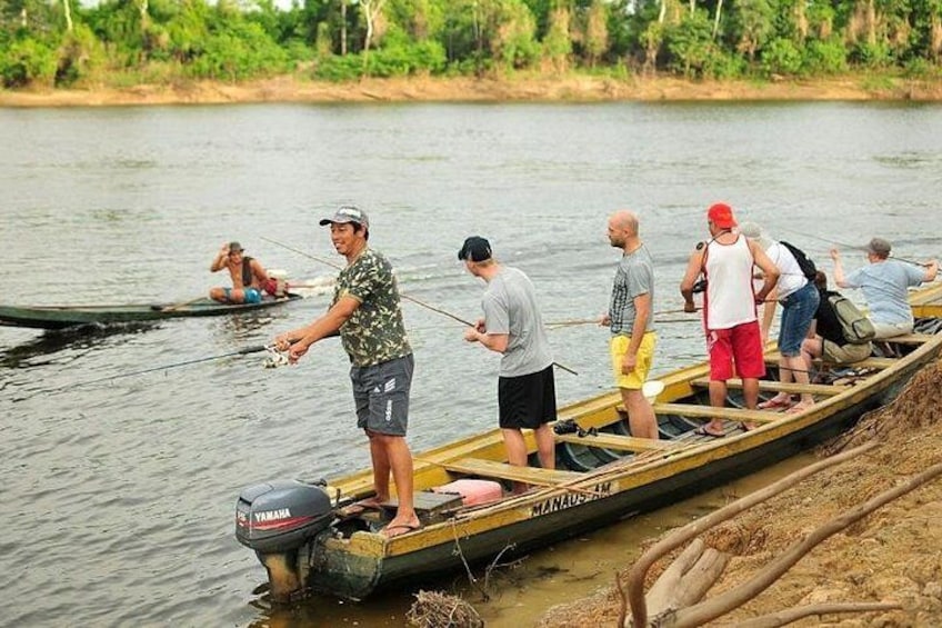 People in a canoe on a river, fishing. 1