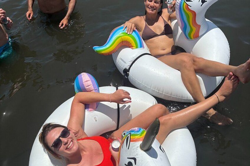 People floating on water with inflatable rings. 3