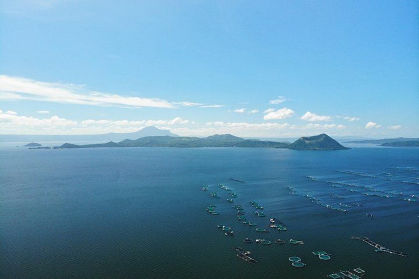 A large body of water with several small islands and a distant mountain range. 1
