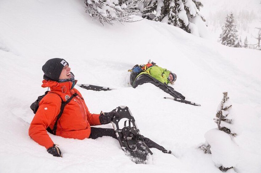A person in a red jacket skiing on a snowy slope. 3