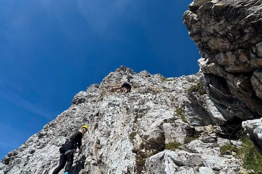 A person climbing a rocky mountain. 4