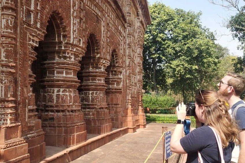 A historical building with intricate brickwork and arches. 1