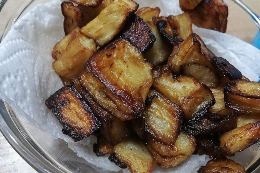 A bowl of roasted potatoes. 5