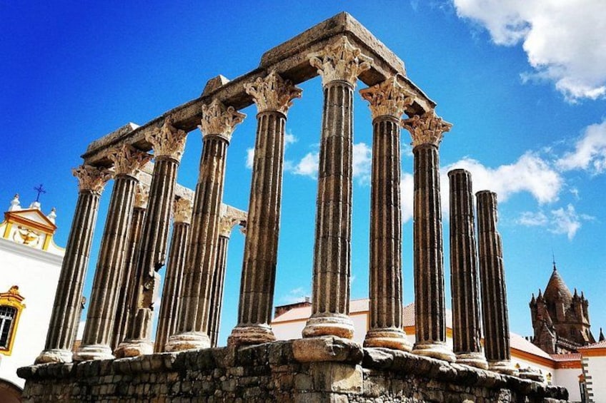 Ancient columns with a clear blue sky in the background. 1