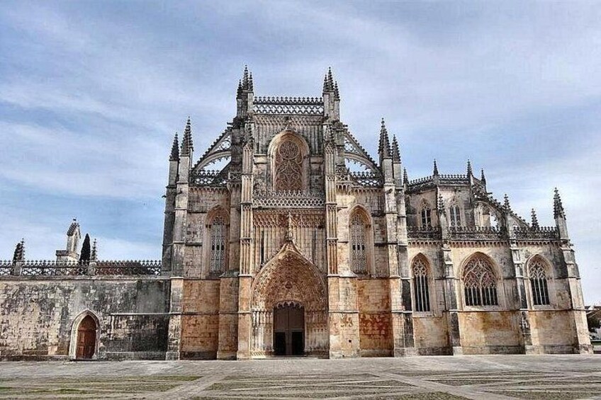 A large Gothic cathedral with intricate stonework and pointed arches. 2