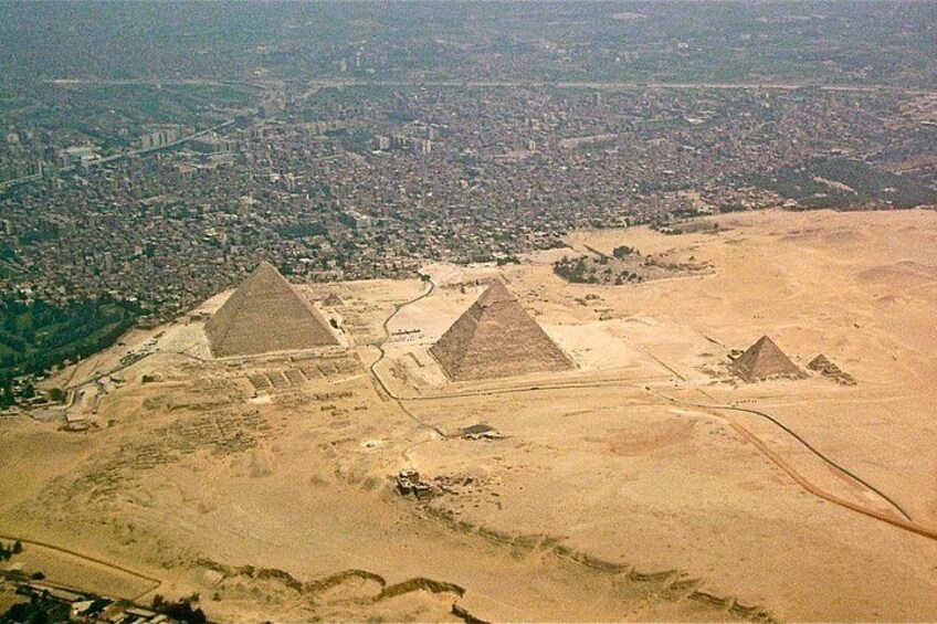 The Great Pyramid of Giza, the Sphinx, and the surrounding desert landscape. 2