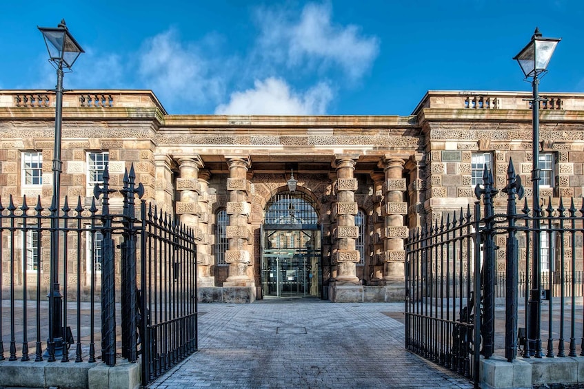 A historic building with ornate columns and a grand entrance. 5