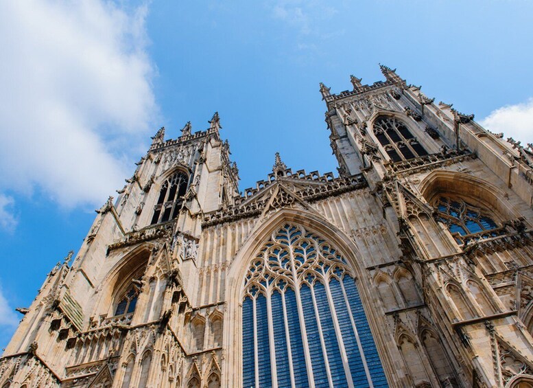 A Gothic cathedral with intricate stonework and pointed arches. 1