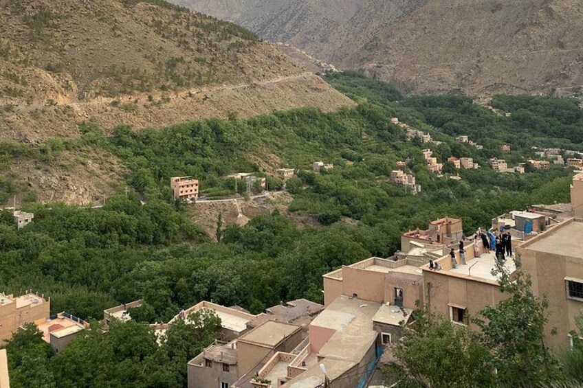 A mountainous village with terraced houses and lush greenery. 3