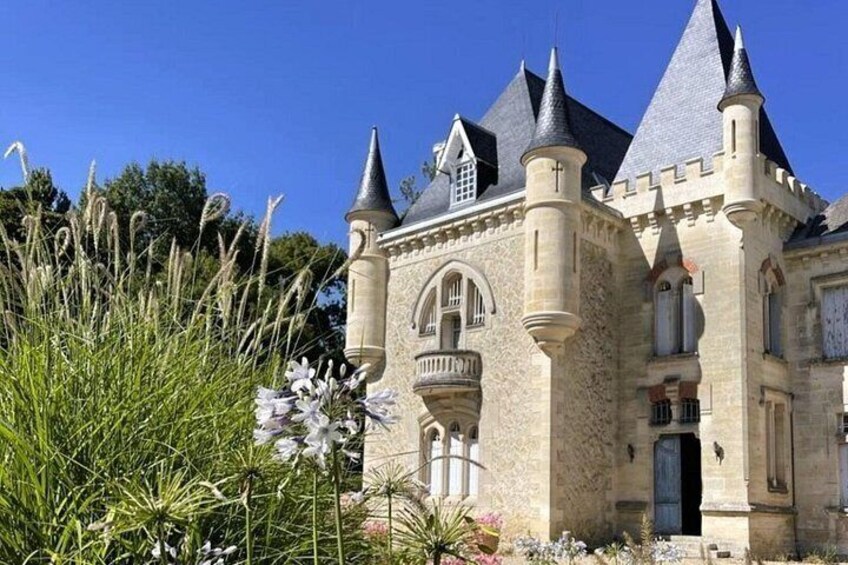 A castle-like building with multiple towers and a stone facade. 4